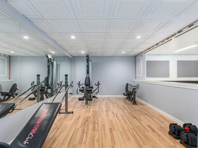 exercise room featuring recessed lighting, baseboards, and wood finished floors