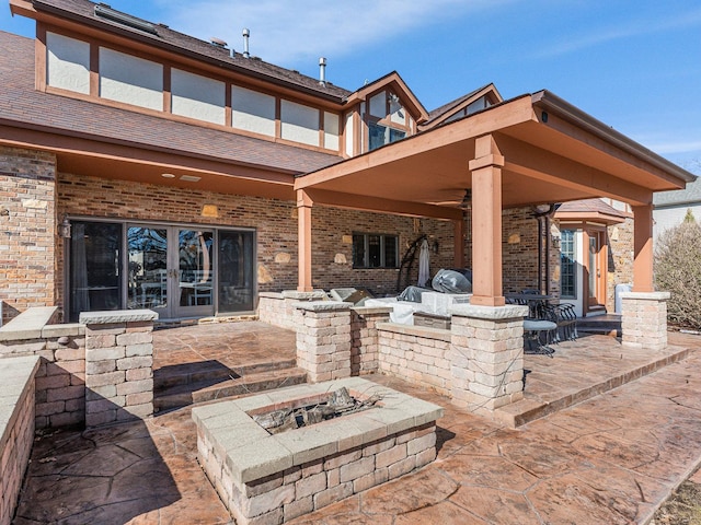 view of patio / terrace featuring a fire pit, french doors, area for grilling, and a ceiling fan