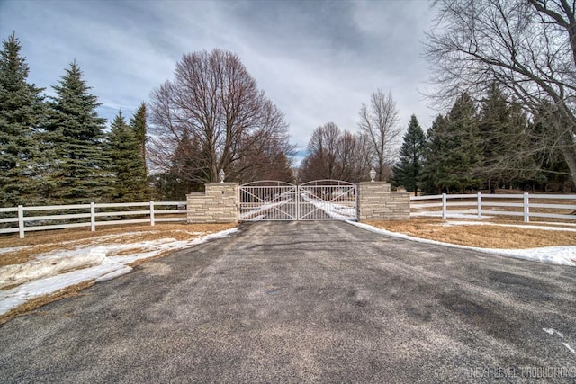 view of road featuring a gate