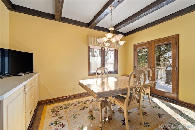 dining area featuring french doors, beamed ceiling, baseboards, and an inviting chandelier