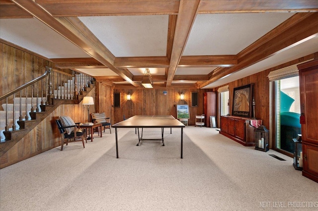 playroom featuring carpet, wooden walls, coffered ceiling, and beam ceiling