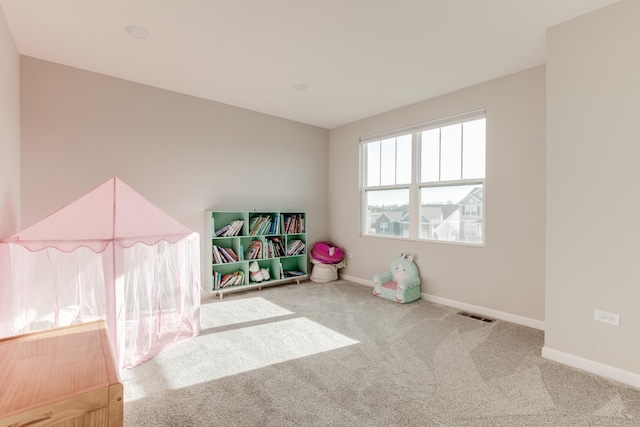 game room featuring light colored carpet