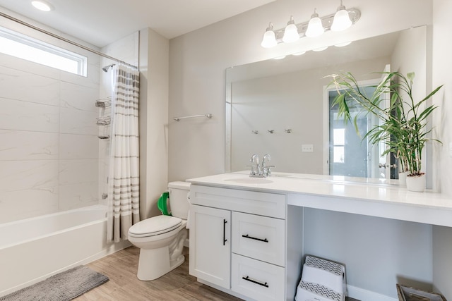 full bathroom with vanity, toilet, shower / tub combo, and wood-type flooring