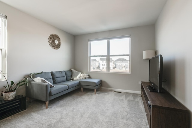 living room featuring light carpet