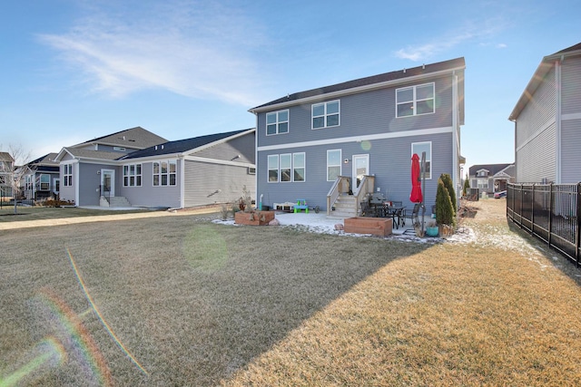 view of front of house with a patio area and a front yard