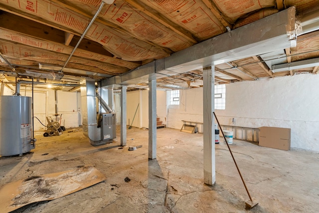 basement with water heater and heating unit