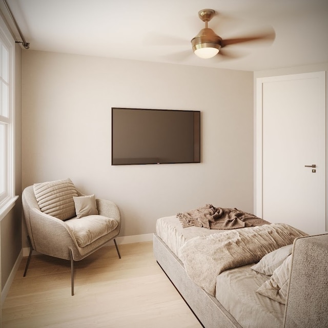 living room featuring light hardwood / wood-style flooring, plenty of natural light, and ceiling fan