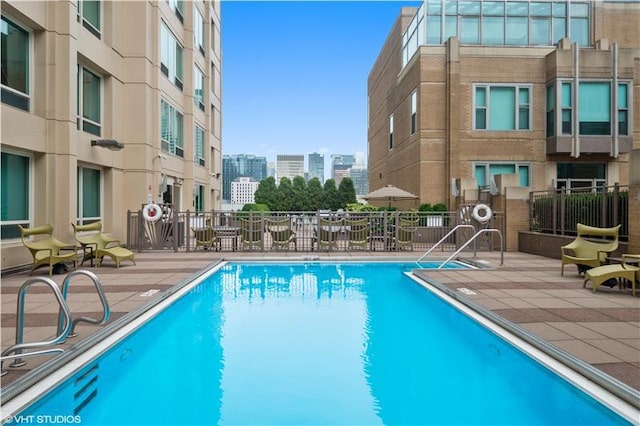 view of pool featuring a patio area