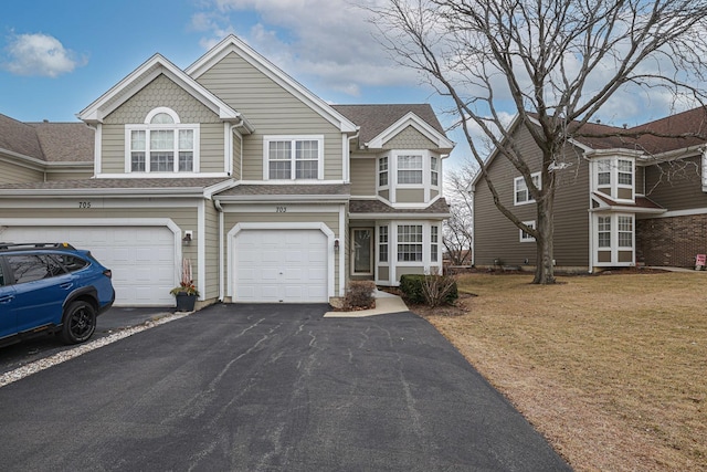 view of front facade featuring a garage and a front yard