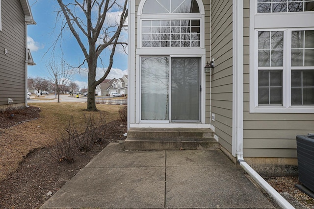 view of exterior entry with central AC