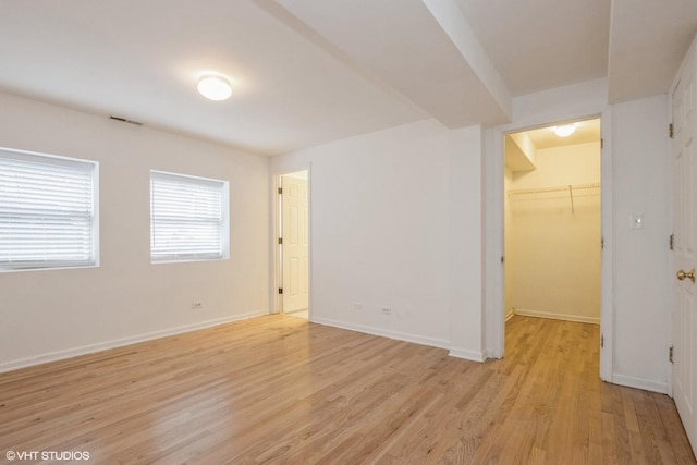 empty room with light hardwood / wood-style floors