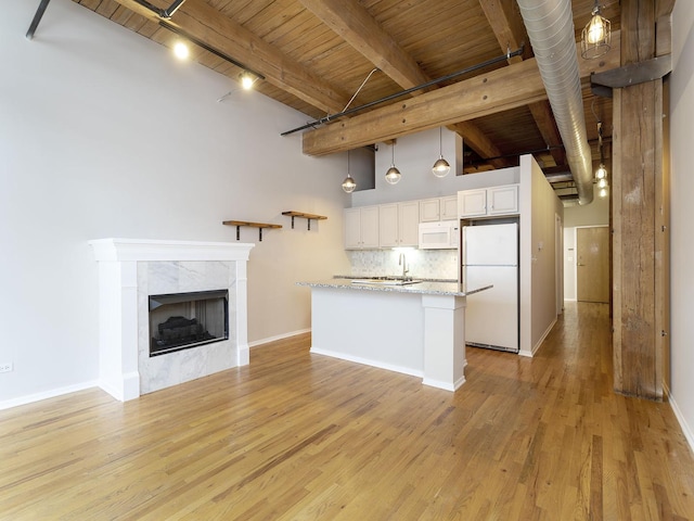 kitchen with white cabinetry, wood ceiling, decorative light fixtures, white appliances, and light stone countertops