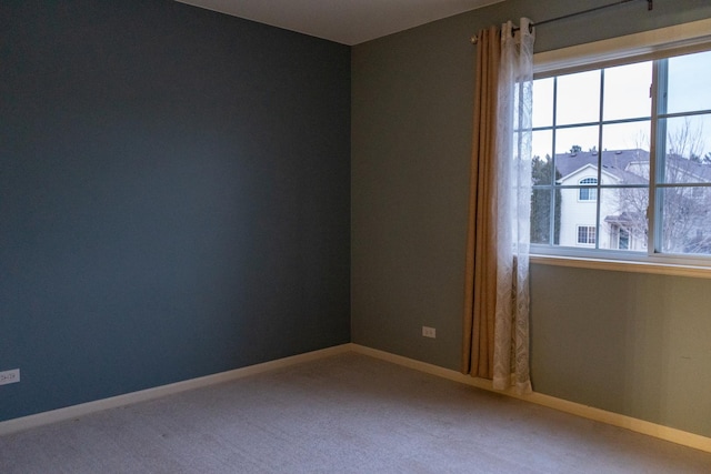 unfurnished room with carpet floors