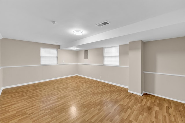 basement featuring light hardwood / wood-style floors