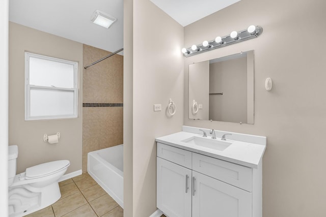 full bathroom with tiled shower / bath, vanity, toilet, and tile patterned flooring