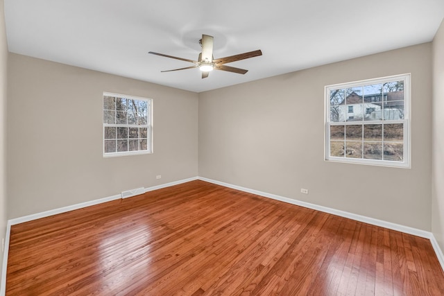 unfurnished room featuring hardwood / wood-style floors and ceiling fan