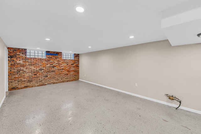 basement with brick wall