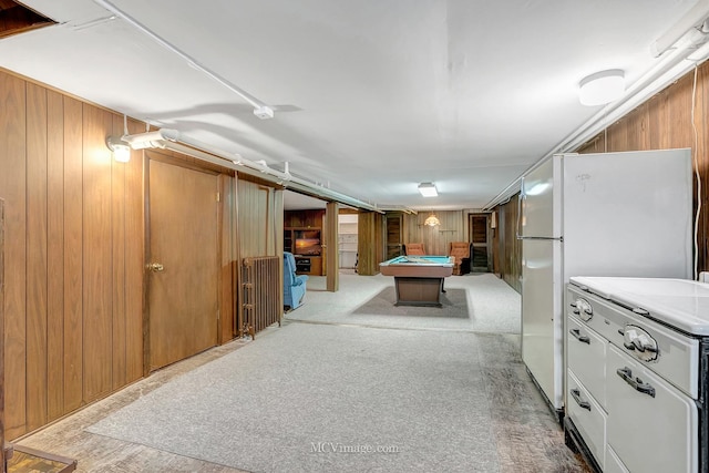 game room featuring light colored carpet, billiards, and wood walls