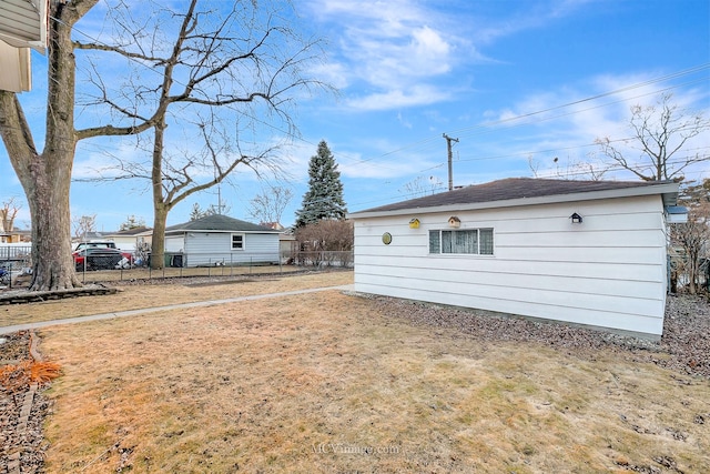 rear view of property featuring a lawn