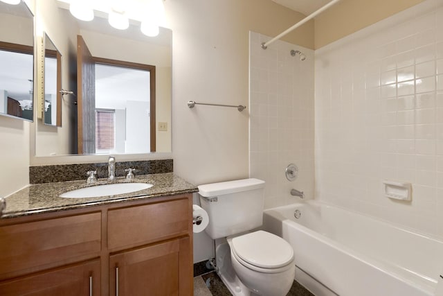 full bathroom featuring vanity, toilet, and tiled shower / bath combo