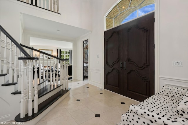 entryway with light tile patterned flooring