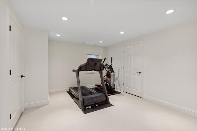 workout room with light colored carpet