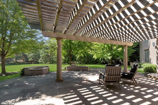 view of patio / terrace with a pergola and a fire pit