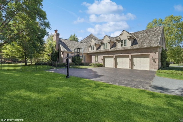 view of front facade with a garage and a front yard