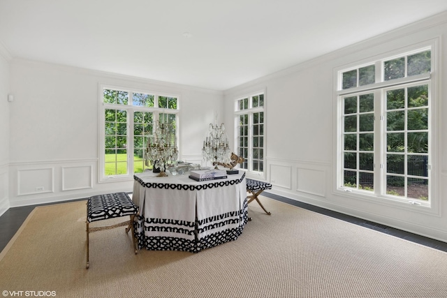 interior space featuring hardwood / wood-style flooring and ornamental molding