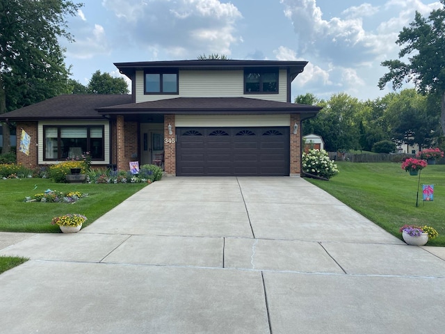 view of front facade with a front lawn and a garage