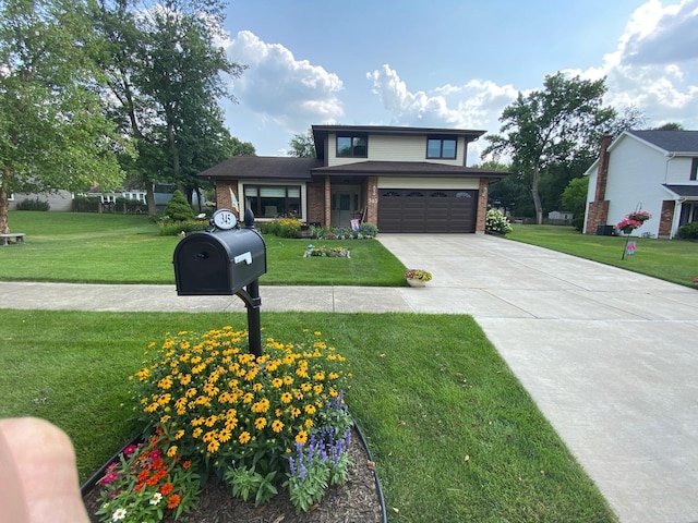 view of front of property featuring a front lawn and a garage