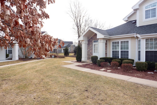 view of home's exterior with a yard