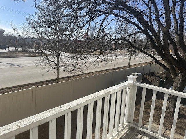 view of snow covered back of property