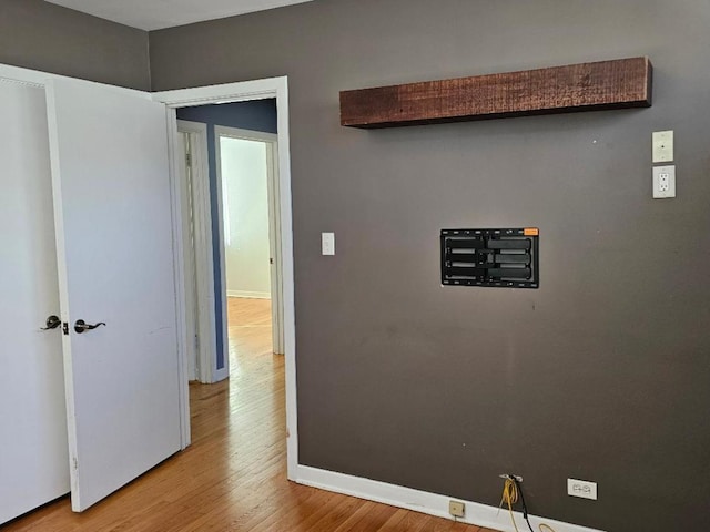 hall with light hardwood / wood-style floors