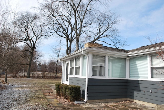 view of home's exterior featuring a sunroom