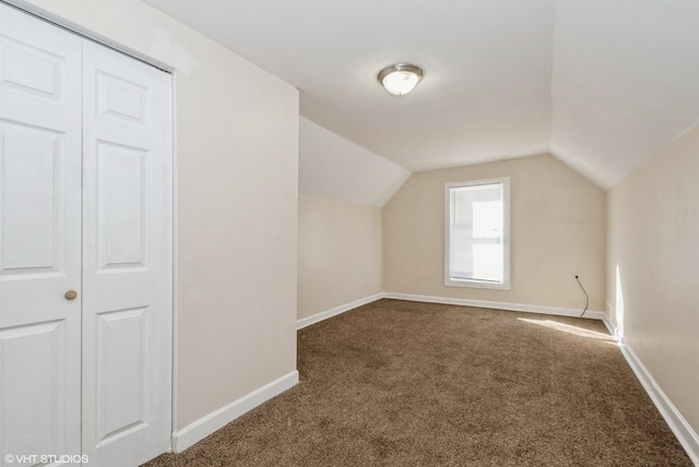 bonus room featuring carpet, vaulted ceiling, and baseboards