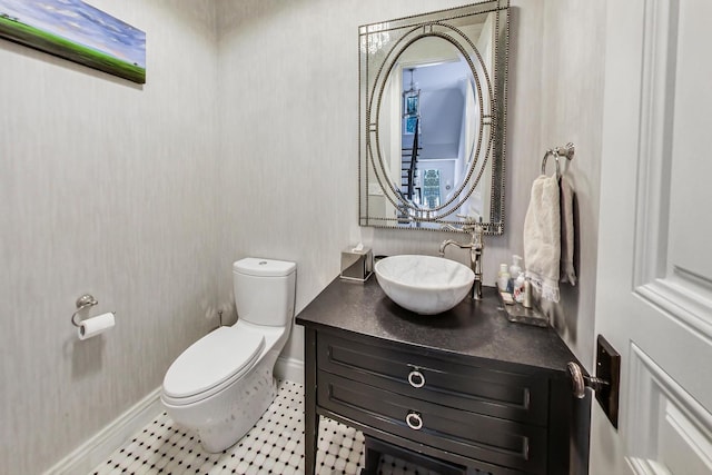 bathroom featuring vanity, toilet, and tile patterned floors