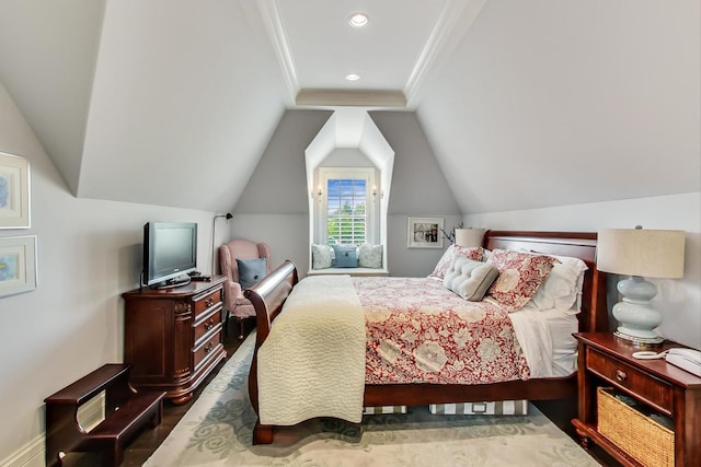 bedroom with lofted ceiling, recessed lighting, crown molding, and wood finished floors