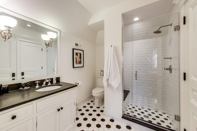 full bathroom with toilet, visible vents, vanity, baseboards, and a stall shower