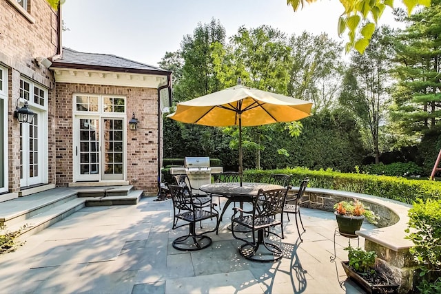 view of patio / terrace with entry steps and outdoor dining area