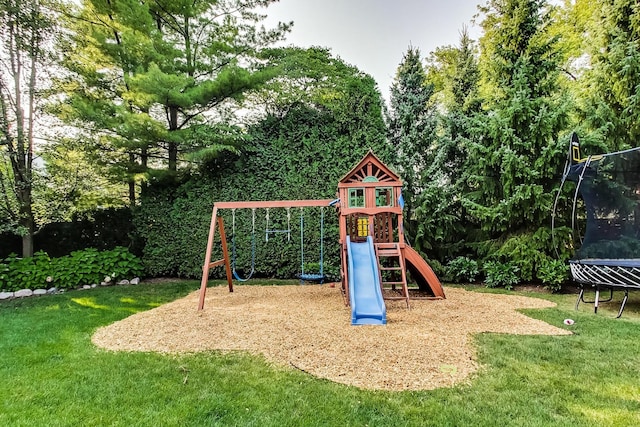 view of play area featuring a yard and a trampoline