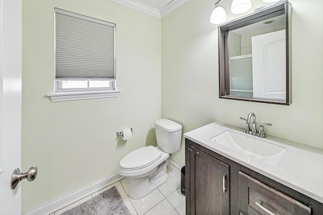 bathroom featuring tile patterned flooring, crown molding, vanity, and toilet