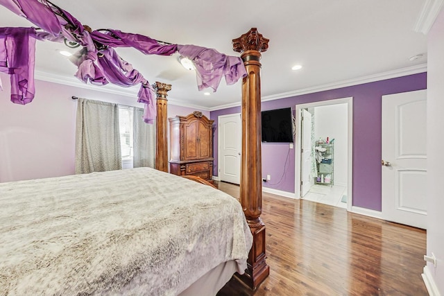 bedroom featuring crown molding and hardwood / wood-style flooring