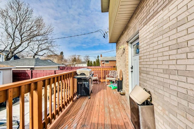 wooden deck featuring area for grilling