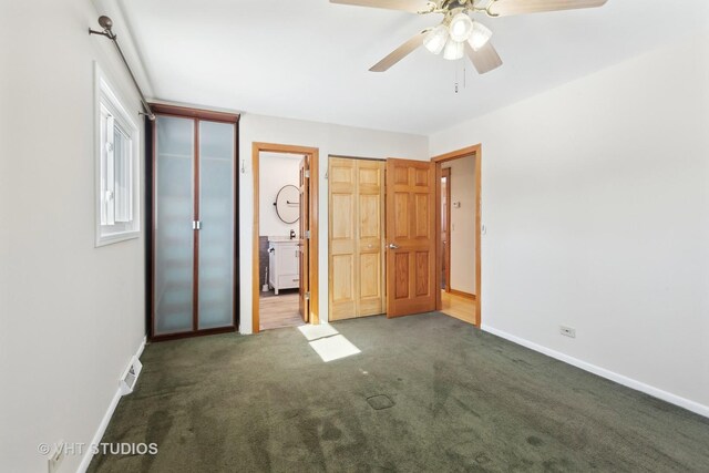 empty room featuring baseboards and wood finished floors