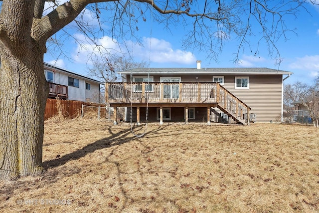 rear view of house featuring stairway, a yard, a fenced backyard, and a wooden deck