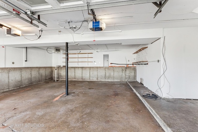 garage featuring a garage door opener and electric panel