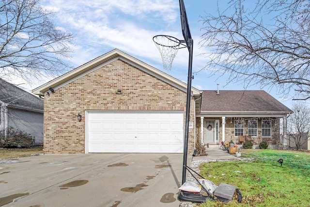 ranch-style home featuring concrete driveway, brick siding, an attached garage, and a front yard