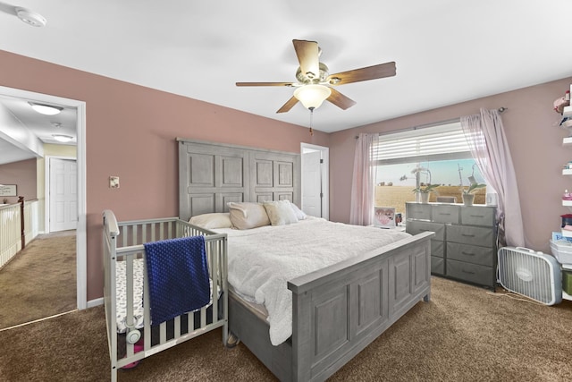 bedroom with dark carpet and ceiling fan