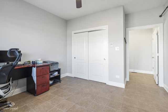 office featuring ceiling fan and baseboards